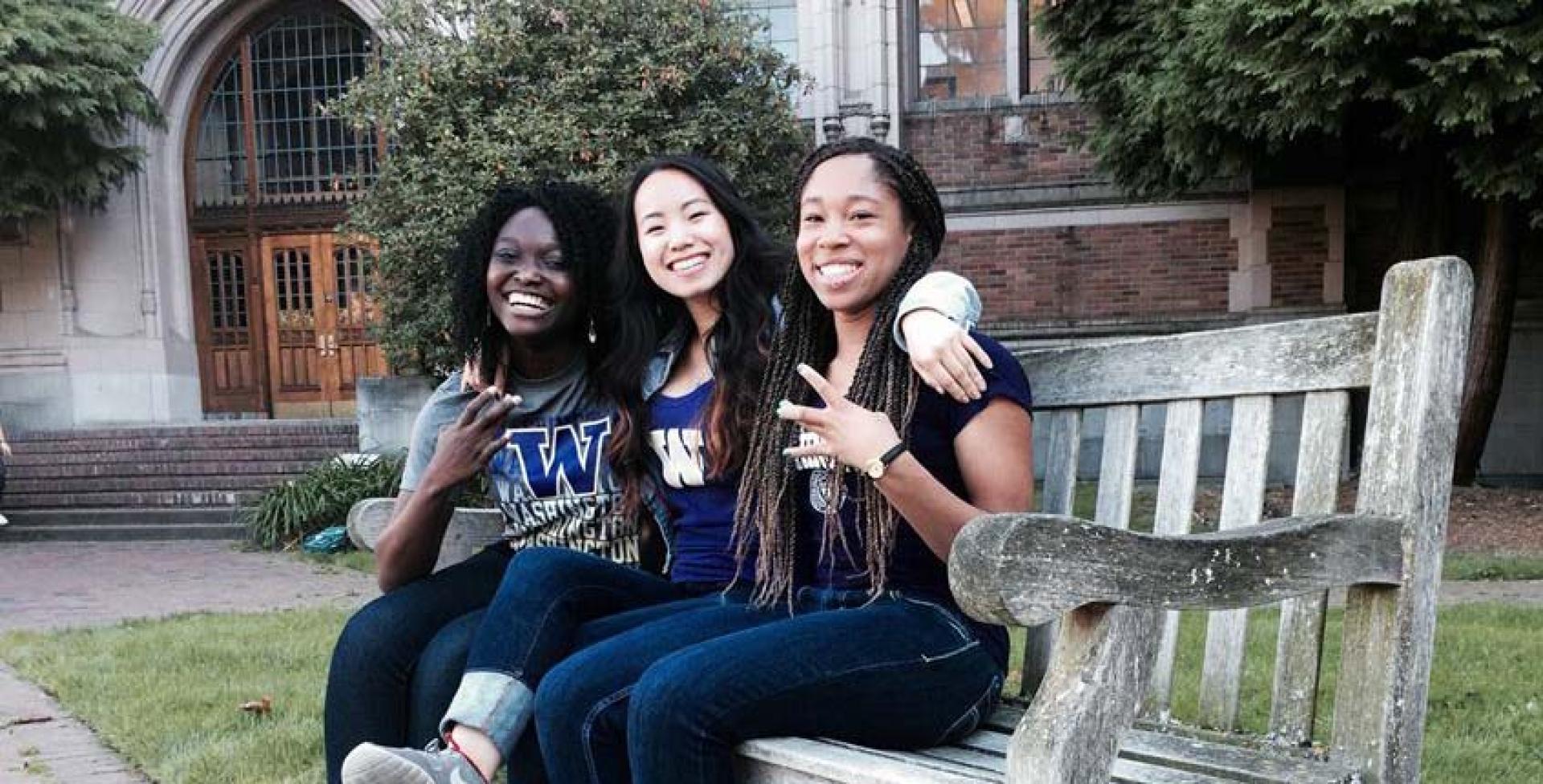 Three students hanging out on the Quad